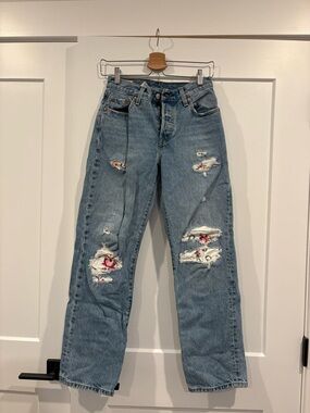 25x30 Light Blue distressed Levi 501 with custom Floral Patch